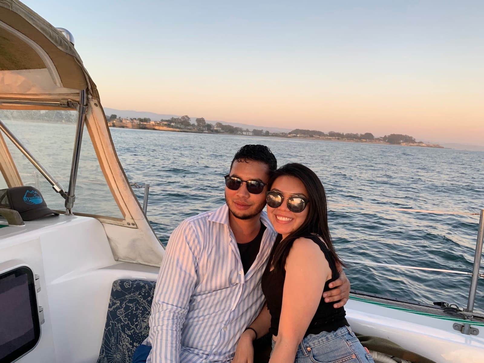 Benjamin and Thảo on a boat at sunset